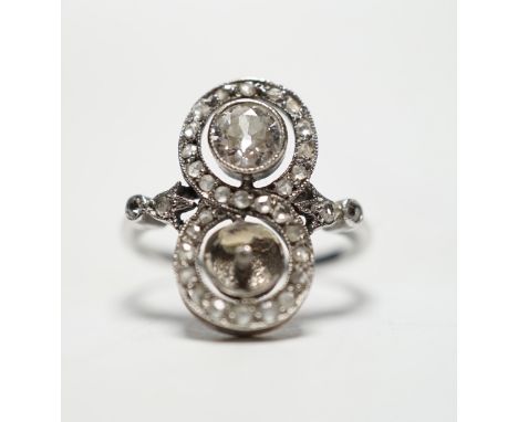 A 1920's white metal, diamond and pearl? set up finger ring, with diamond set borders and diamond set shoulders, (pearl missi