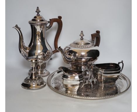 A large quantity of plated wares including a four piece tea and coffee set, other plated wares and cased pan scale