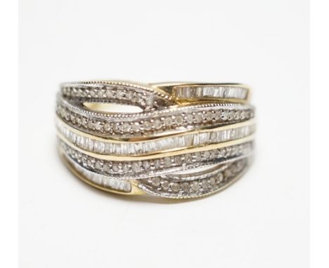 A modern 9ct gold and five row baguette and round cut diamond cluster set half hoop dress ring, size P, gross weight 4.5 gram