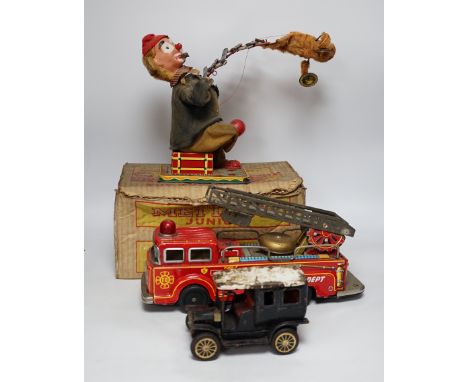 Four tinplate toys; a model of a 1920s taxi, a 1960s German made fire engine, an automaton clown, and a boxed Mettype Junior 