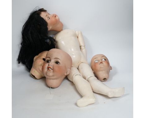 A Heubach doll and five bisque doll’s heads