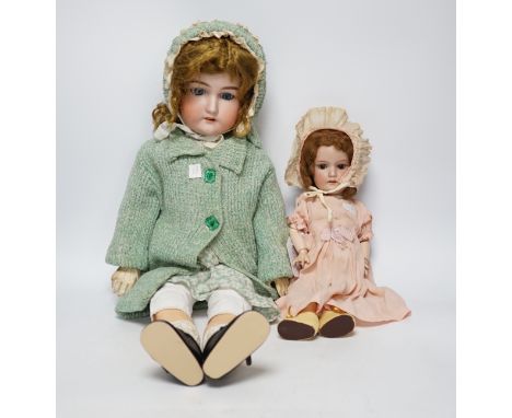 An AM390 bisque head doll, 63cm good condition, and an AM390, missing two fingers and wear on other hand, 58cm
