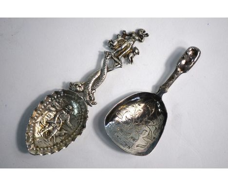 A Continental cast silver caddy spoon with decorative stem and engraved bowl, London import 1905, to/w a George IV caddy spoo
