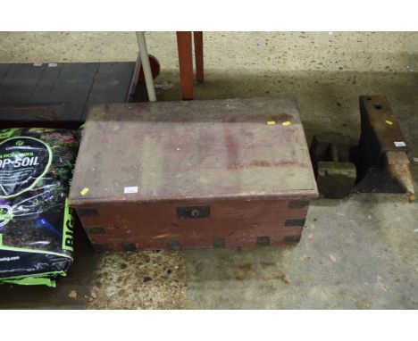 A wooden tool box including various hand tools