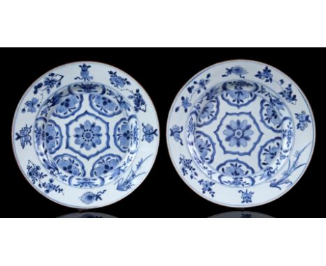 2 porcelain dishes with blue lotus decor in the heart surrounded by cranes and various Buddhist symbols in the rim, China Kan