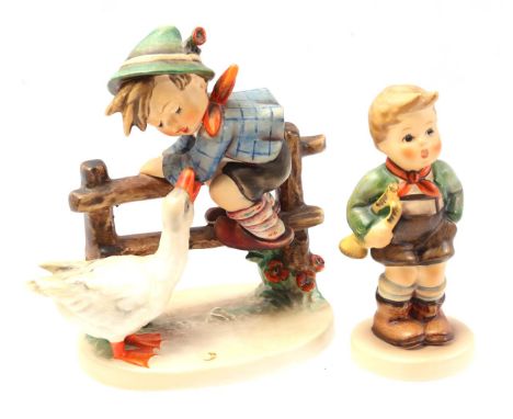 2 Goebel Maria Hummel figurines, 195/1, boy with goose at fences, 14 cm high and 45, boy with trumpet, 11.5 cm high