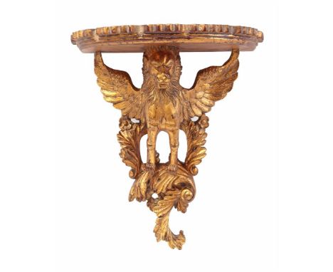 Wooden, richly decorated, gold-colored wall console of a winged lion, symbol of Venice of St. San Marco Evangelist, 43 cm hig