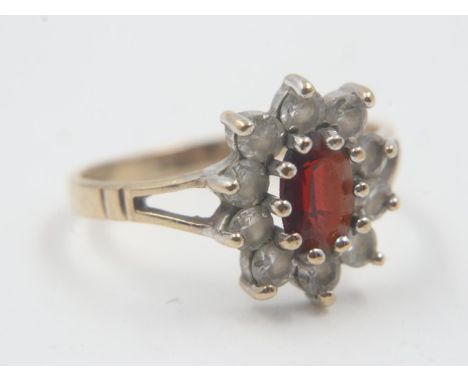 Ladies 9ct gold dress ring set with garnet and CZ, size J, 1.46g. UK P&amp;P Group 0 (£6+VAT for the first lot and £1+VAT for