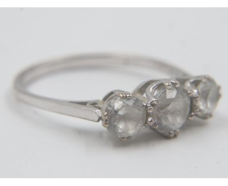 Unmarked 9ct white gold trilogy ring, set with white sapphires, size Q, 3.2g. UK P&amp;P Group 0 (£6+VAT for the first lot an