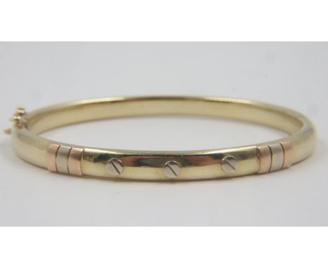 14ct gold snap bangle, with applied rose and white gold detail, 13.5g. UK P&amp;P Group 0 (£6+VAT for the first lot and £1+VA