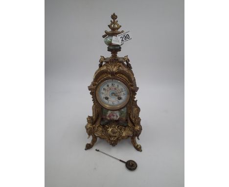 French Ormolu mantel clock, with porcelain panels and finial, H: 41cm. Not available for in-house P&amp;P