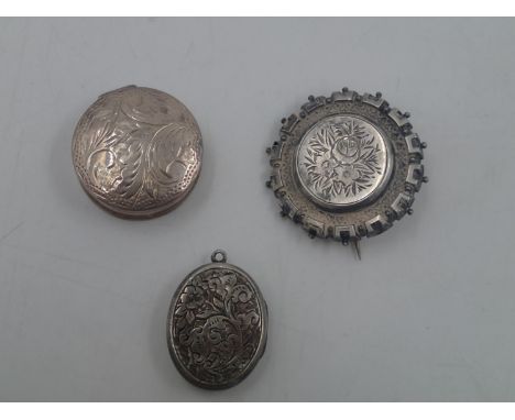 Victorian silver mourning brooch, silver locket and a silver pill box containing a faceted garnet. UK P&amp;P Group 0 (£6+VAT