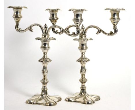 A Pair of Edwardian Silver Two Light Candelabra, R & W Sorley, London 1902, the foliate scroll branches supported on a knoppe