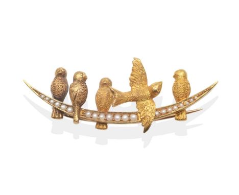 A Seed Pearl Bird Brooch, modelled as five birds above a seed pearl set crescent, measures 2cm by 5.5cm The brooch is in good