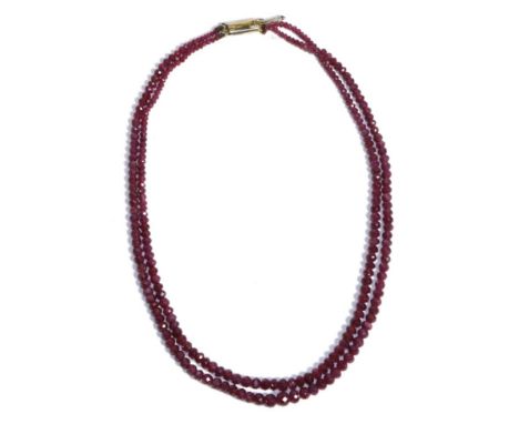 A Ruby Bead Necklace, a double strand of graduated faceted ruby beads, length 40cm The necklace is in good condition. The bea