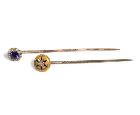 A Sapphire and Diamond Stick Pin, a round cut sapphire within a border of old cut diamonds, total estimated diamond weight 0.