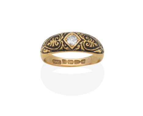 An 18 Carat Gold Solitaire Diamond Mourning Ring, an old cut diamond star set to a tapering shank picked out in black enamel 
