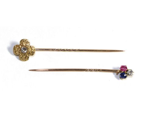 A Diamond, Sapphire and Ruby Clover Stick Pin, estimated diamond weight 0.15 carat approximately and a diamond stick pin, an 