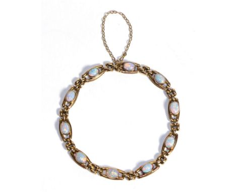 An Opal Bracelet, oval cabochon opals in rubbed over settings to two bar links, spaced by groups of three short links, length