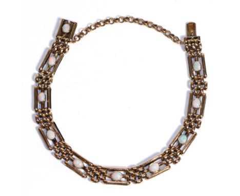An Opal Bracelet, three bar links each set with an oval cabochon opal in a rubbed over setting, alternating with shorter gate