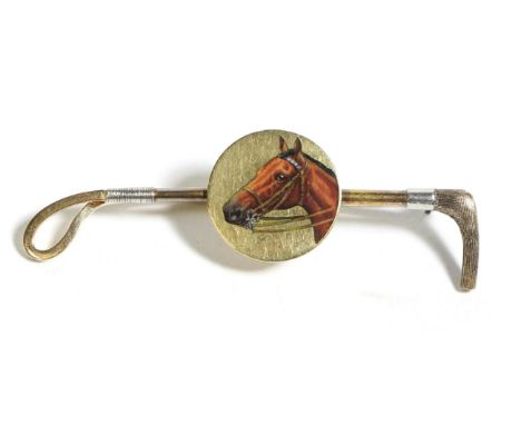 An Enamelled Equine Portrait Crop Brooch, measures 2.5cm by 6.5cm  The brooch is in good condition, the circular plaque is la