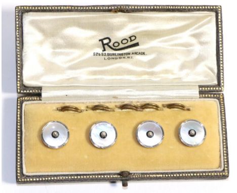A Cased Set of Four Dress Buttons, a seed pearl within a border of black enamel to mother-of-pearl plaques in rope frames, re