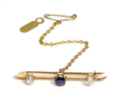 A Sapphire and Diamond Bar Brooch, a round cut sapphire to a knife edge bar terminating in two old cut diamonds, total estima