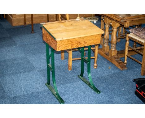 A Pine Child's Student Desk, with cast metal frame and ceramic inkwell.  Height 30" x 22" x 18".