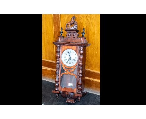 Wooden Wall Clock with twisted side supports and decorative top finial of a rearing horse, white face with Roman numerals, pe