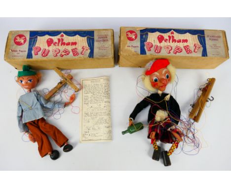 Pelham Puppets - Two boxed vintage Pelham Puppets. Lot consists of MacBoozle (standard puppet) with a Junior control Boy pupp