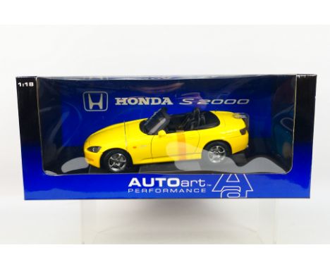 Auto Art - A boxed 1:18 scale Auo Art #727644 Honda S2000. The model in yellow appears to be in Mint condition, housed within