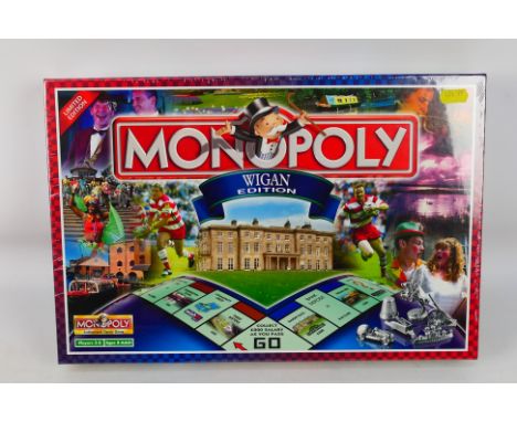 Monopoly - Parker - A boxed, factory sealed 'Wigan Edition' Monopoly board game. The collectable game is presumed Mint being 