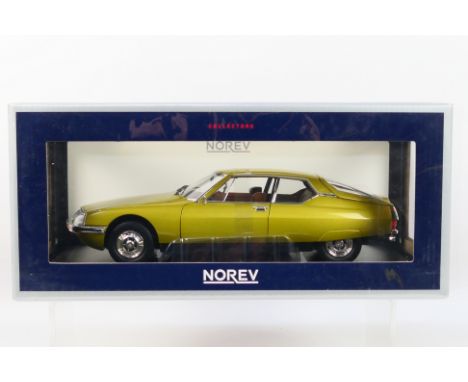 Norev - A boxed Norev #181730 1:18 scale Citroen SM 1971. The model in Golden Leaf appears to be in Mint condition, housed wi