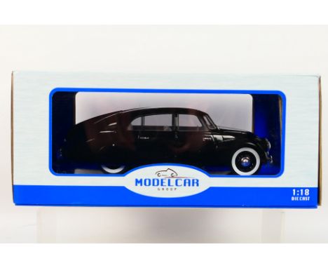 Model Car Group - A boxed 1:18 scale Model Car Group Tatra 87. The model in black appears to be in Mint condition, housed wit