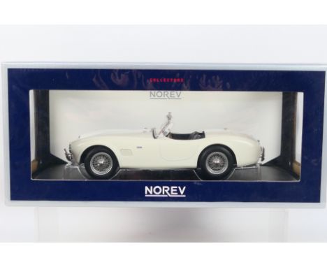 Norev - A boxed Norev #182752 1:18 scale AC Cobra 289 1963. The model in white appears to be in Mint condition, housed within