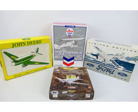 Corgi Aviation Archive - Ertl Collectibles - A boxed diecast model aircraft and three diecast model aircraft banks. Lot consi