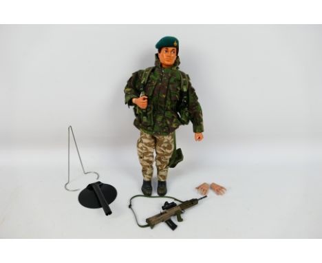 Palitoy  - Action Man - An unboxed 1964 Action Man action figure with Flock hair and eagle eyes in a arm camouflage uniform. 