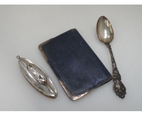 A small leather wallet having HM silver tips, an HM silver nail buffer and a white metal spoon stamped sterling 925 having mo
