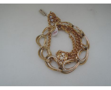 A 1980's style necklace by Givenchy having a central panel decorated by diamante on a double chain collar, another necklace b