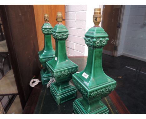 Three modern ceramic table lamps designed as green oriental style vase
