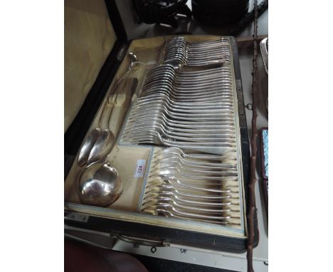 An early 20th century leather clad travel case with chamois leather lining containing an Austrian silver plated part canteen 