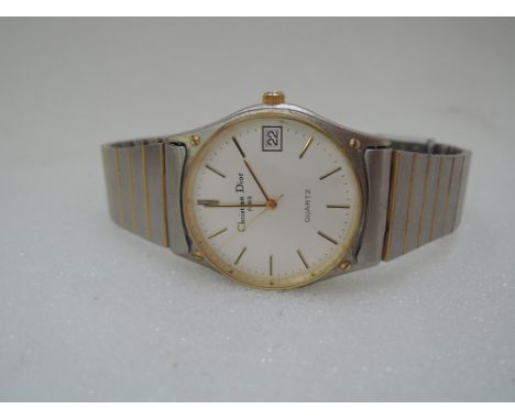 A ladies quartz wrist watch marked Christian Dior Paris having baton numeral dial and date aperture, 