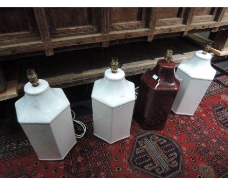 Three modern ceramic table lamps designed as white hexagon style, and a similar brown lamp
