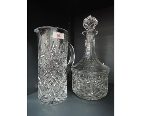 A 20th century glass decanter and a similar water jug