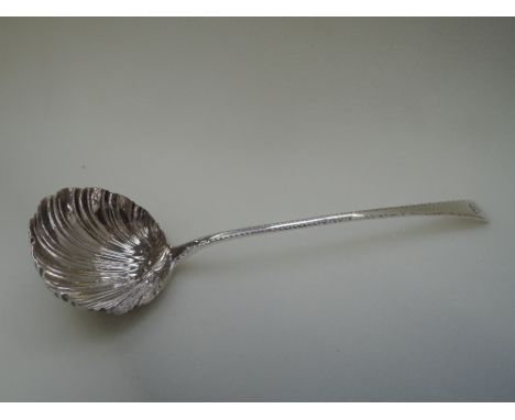 A Georgian silver Old English pattern soup ladle having shell bowl and rampant lion monogram to terminal, London 1764, Paul C