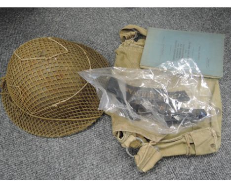 An army steel helmet, a Home Guard shoulder bag, a RAF log book and two Navy hat bands
