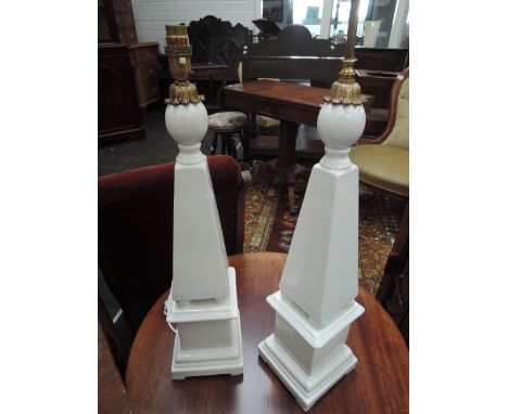 A pair of modern ceramic table lamps designed as white obelisks 