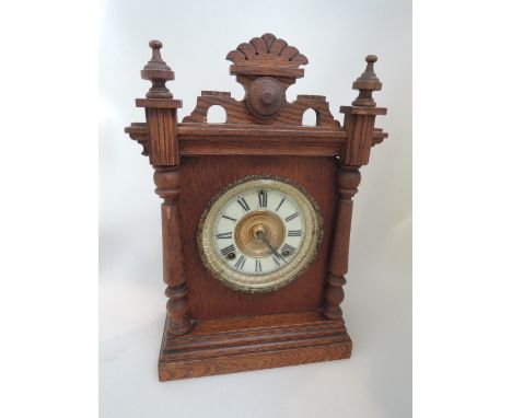 A late 19th century American oak case mantel clock by The Ansonia Clock Co, New York