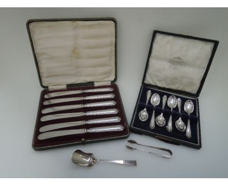 A cased set of silver handled butter knives, Birmingham 1911, Elkington & Co, a cased set of silver teaspoons having decorati