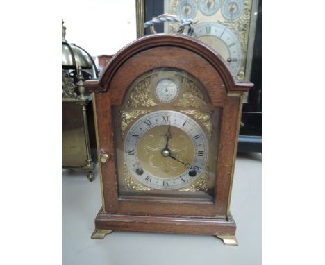 A late 20th century mahogany cased period style mantel clock by F W Elliott